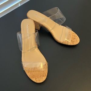 Clear corked heel. Never worn. Comes with box!